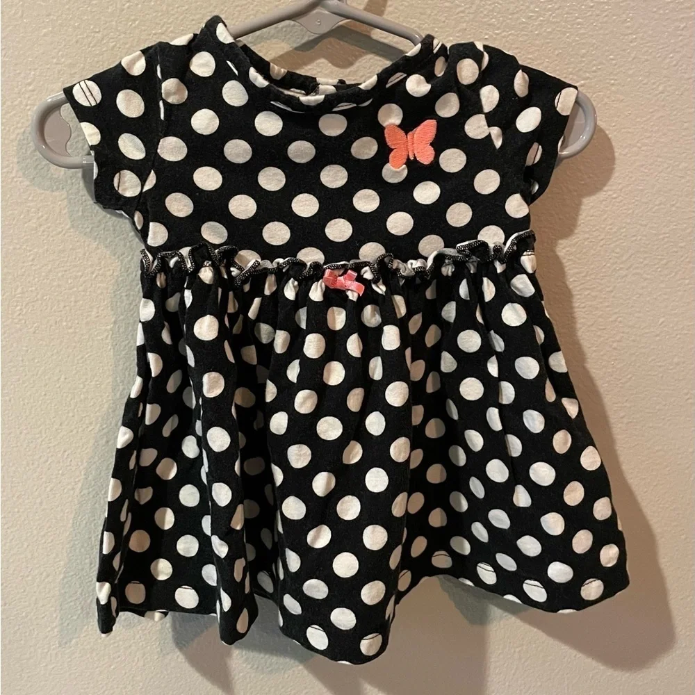 Carter’s Navy and white polka dot dress with pink butterfly and bow details.